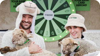 photo of 2 people holding sheep