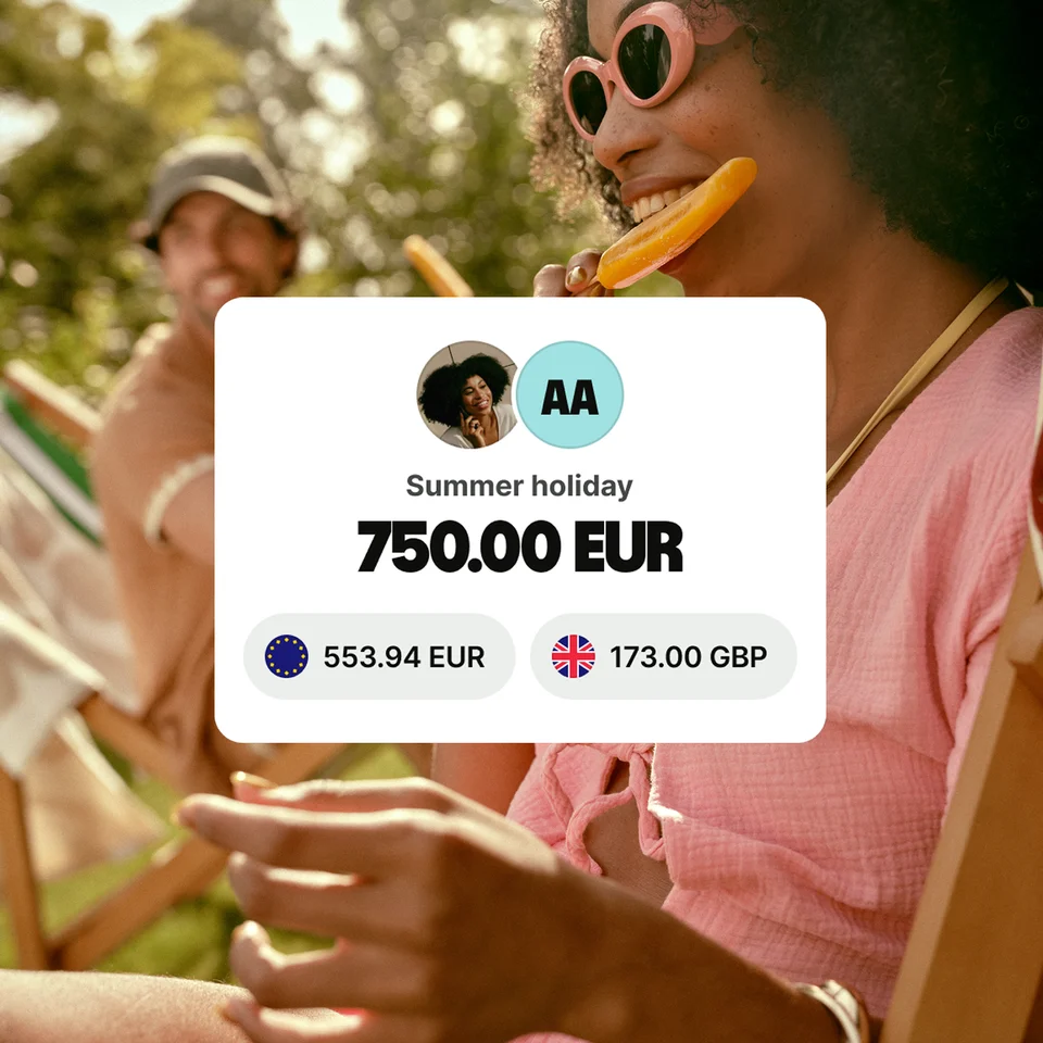 A woman wearing sunglasses smiling and eating an orange popsicle outdoors. Overlaid is UI from the Wise app showing her holiday budget.