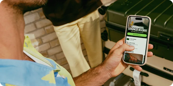 Man with Wise app open looking at lounge passes