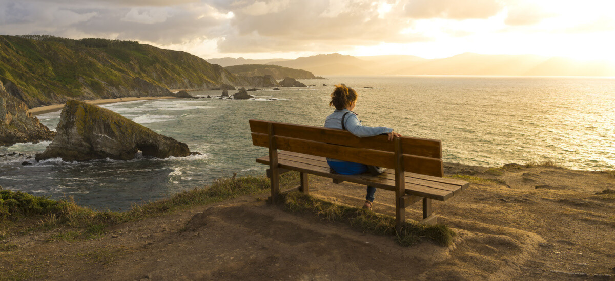 woman-sitting-on-the-best-bench-in-the-world-loiba-spain