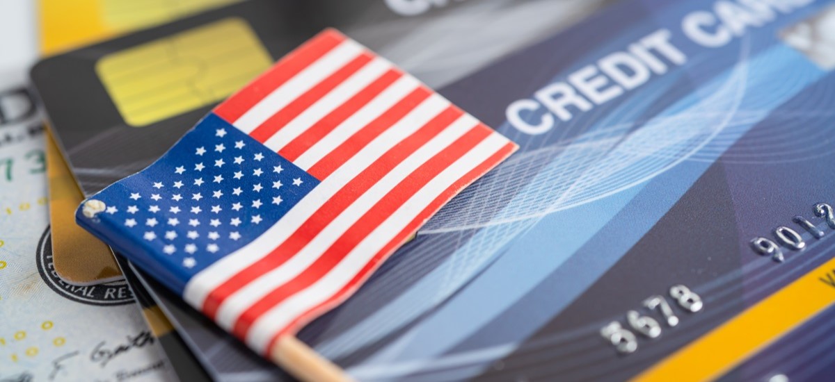 Bank cards next to small US flag