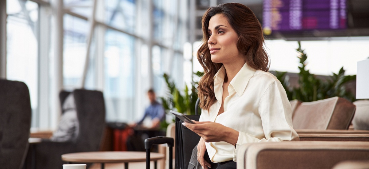 smart-looking-woman-sitting-at-business-class-lounge-airport