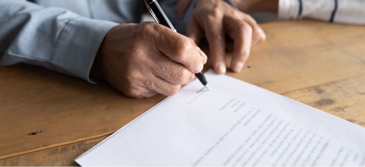 Man signing documents