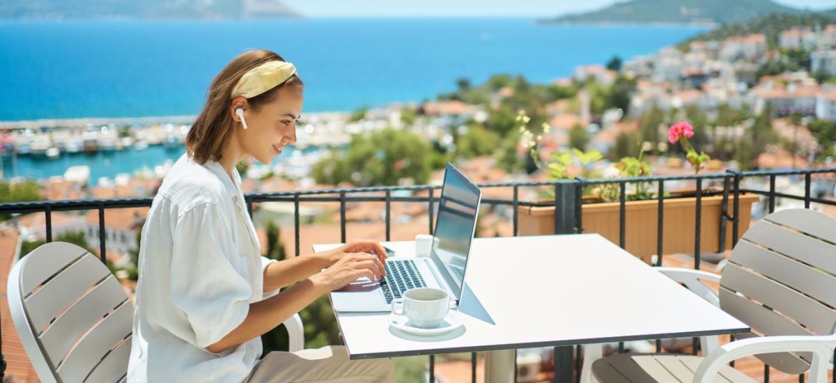 young-woman-sitting-working-behind-laptop