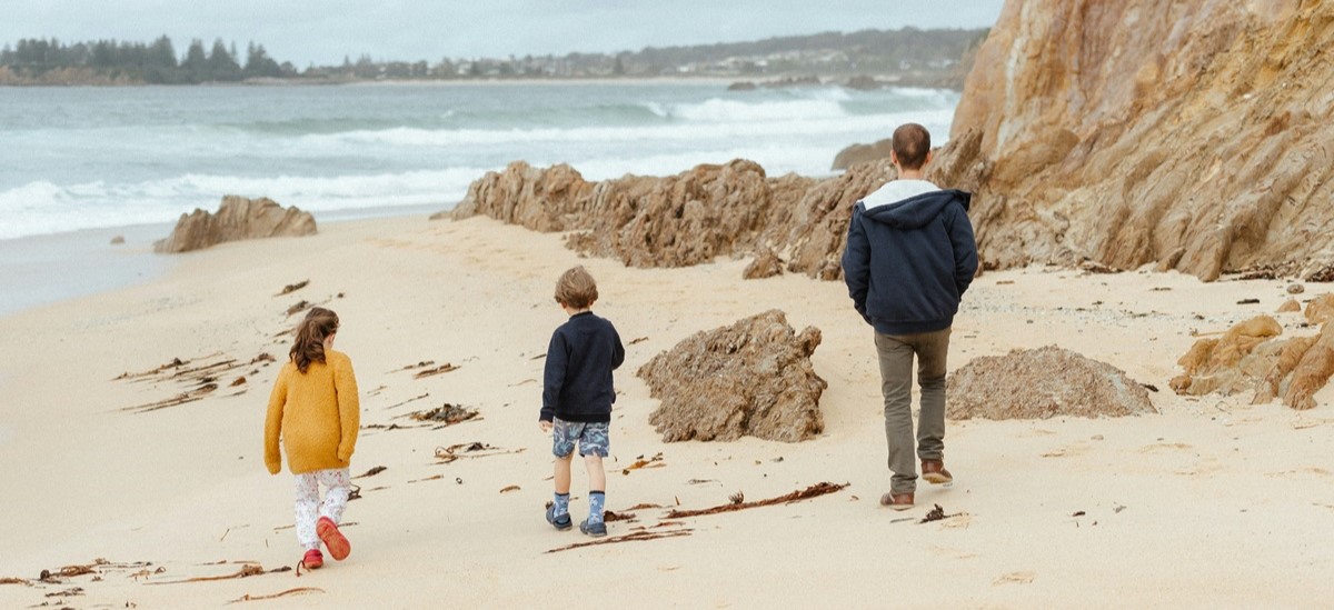 Family on beach in Australia