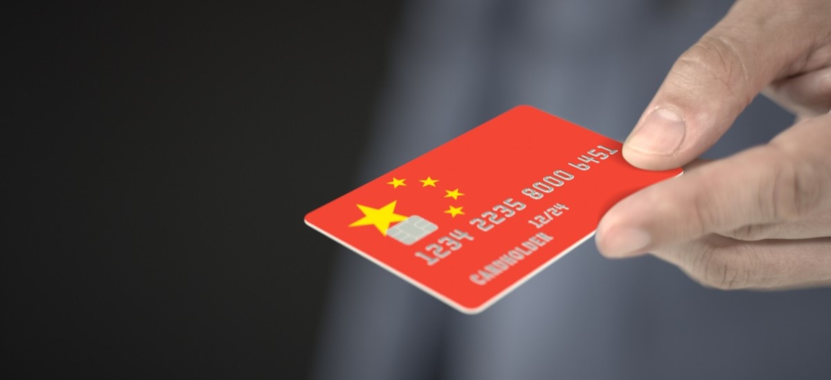 Red bank card with a Chinbese flag design