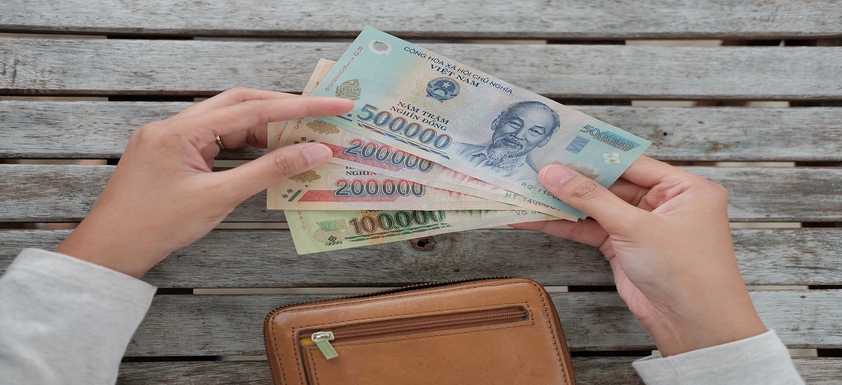 Pov closeup of someone counting Vietnamese dong