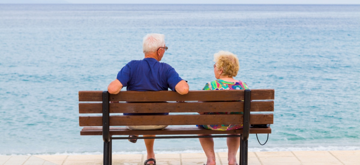 older-couple-sitting-on-a-bench