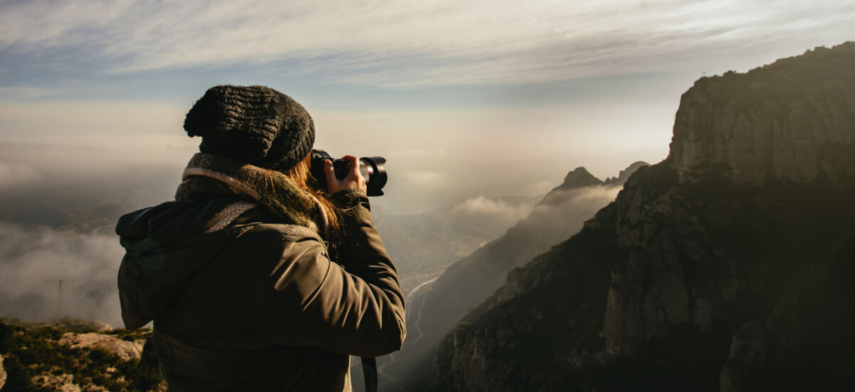 person-taking-photographs-of-monestir-de-montserrat-spain