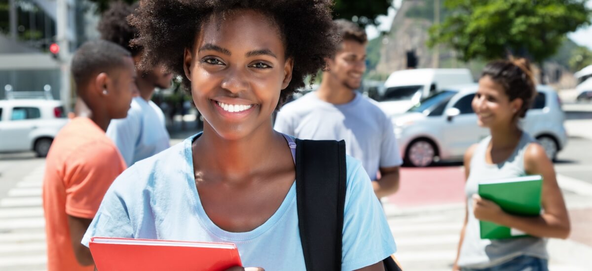 smiling-student-with-group-of-friends