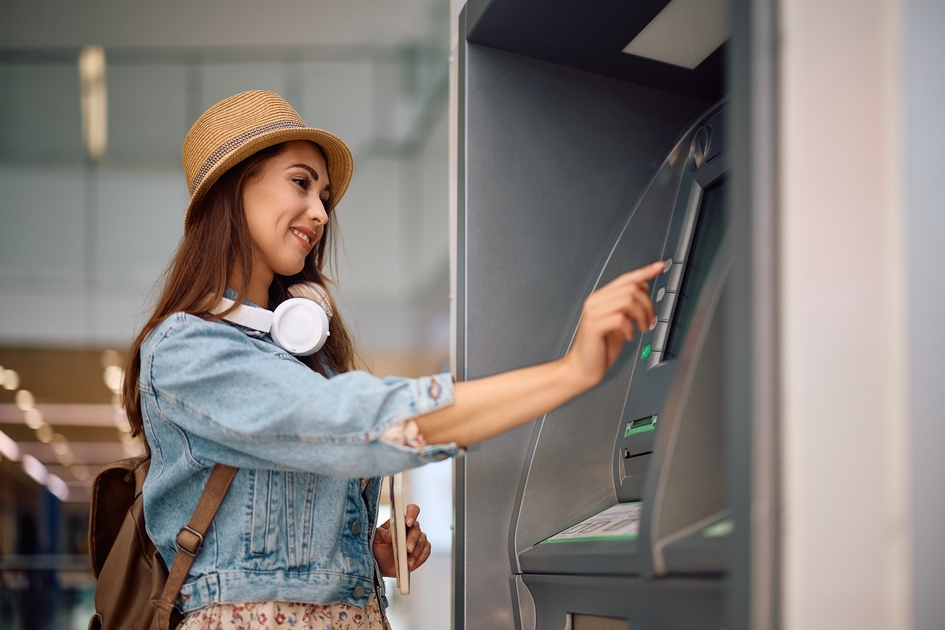 Image showing someone withdrawing money from a Hong Kong ATM with Wise card