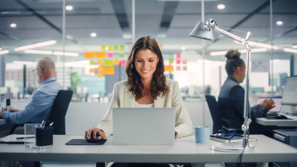 woman-working-on-meeting-room-with-computer