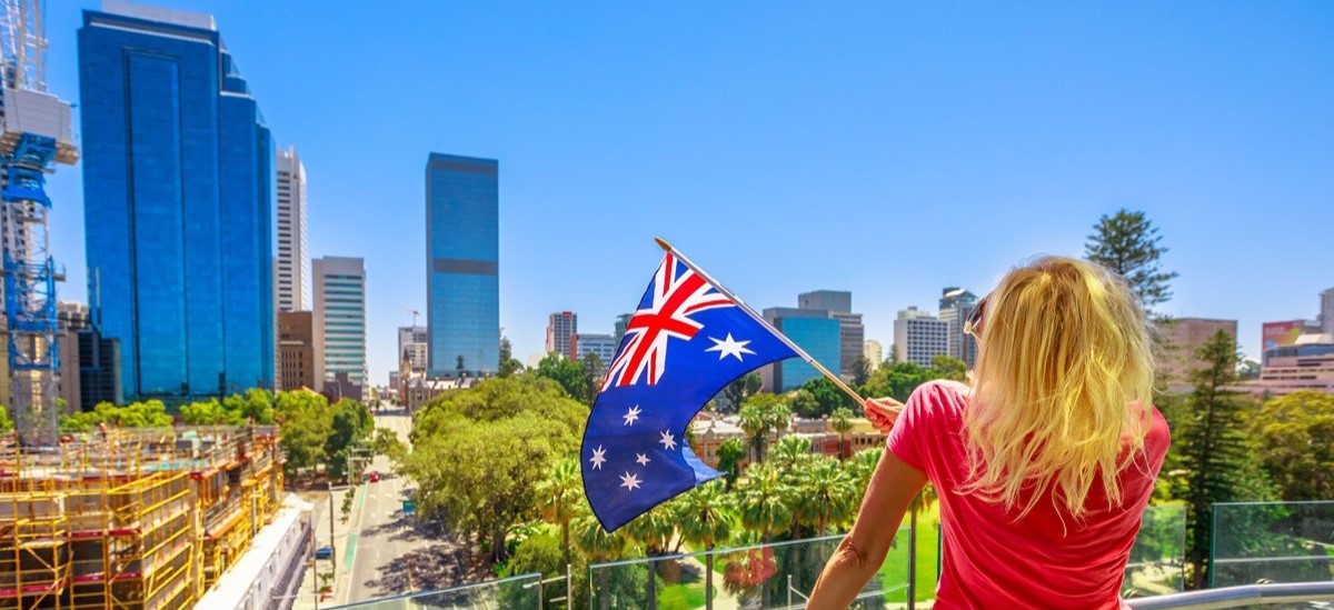Woman waving Australian flag