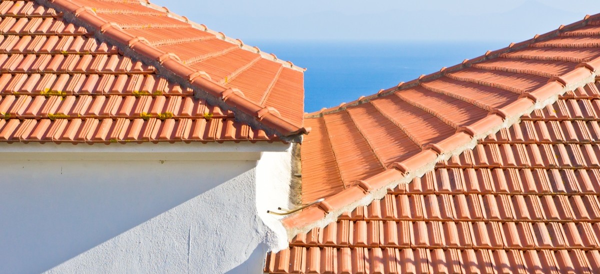 close up of two connected newly tiled roofs in Greece