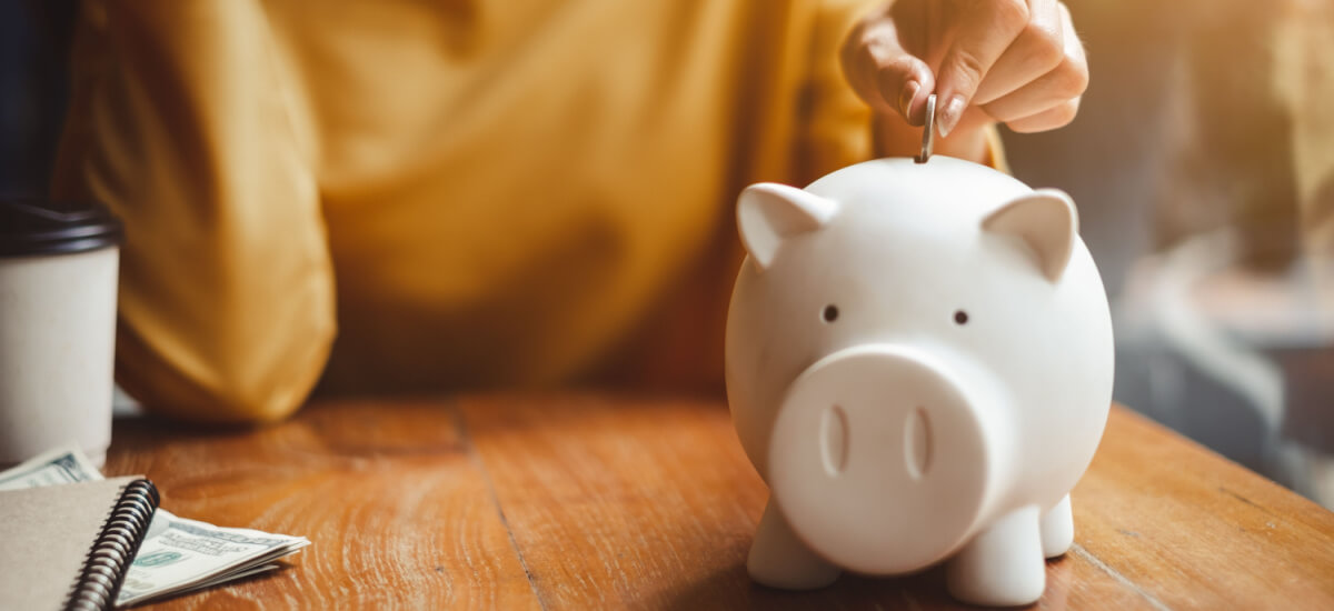 putting-coins-piggy-bank