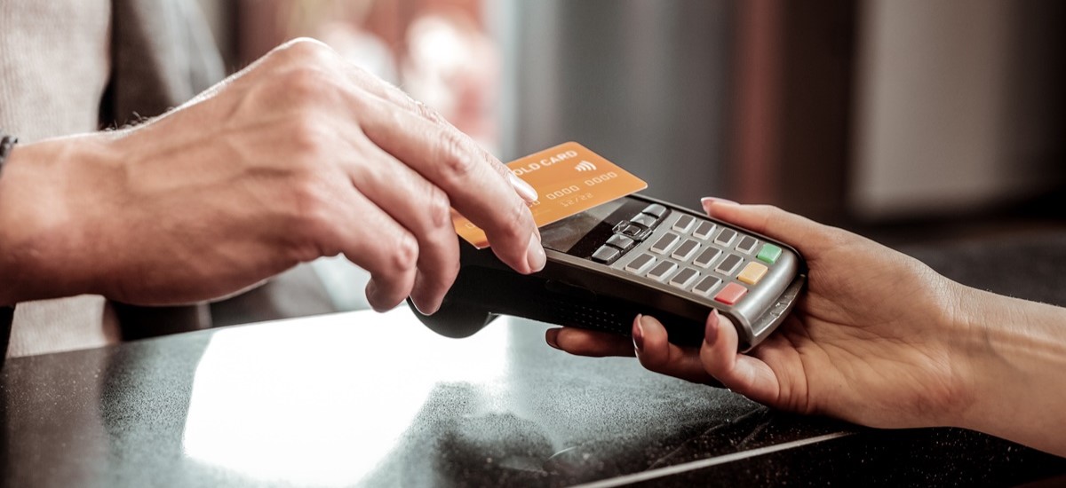 Close up of a card transaction in a resort