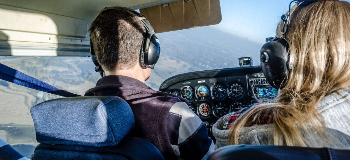 two-people-flying-a-plane