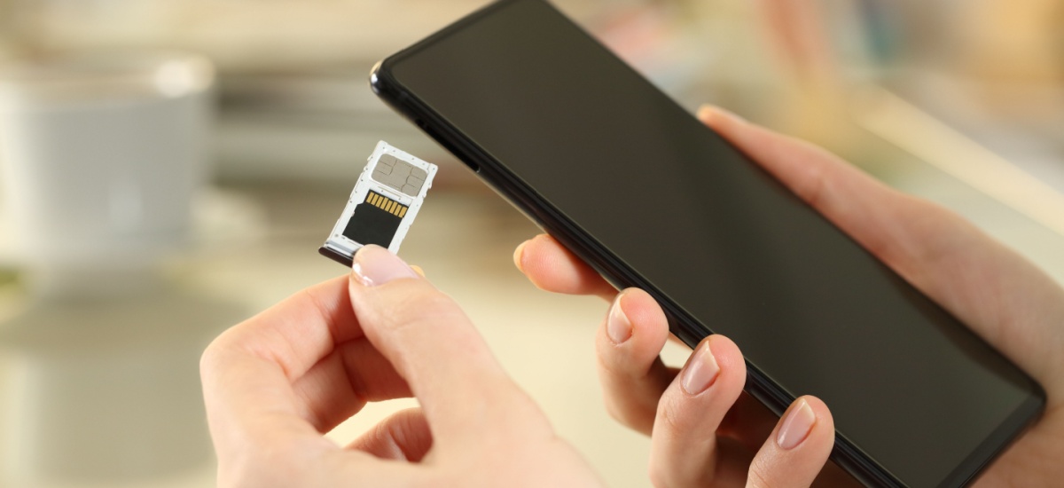 woman-holding-sim-card-phone