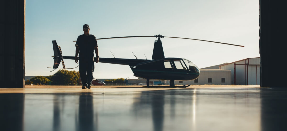 pilot-walking-away-from-parked-helicopter