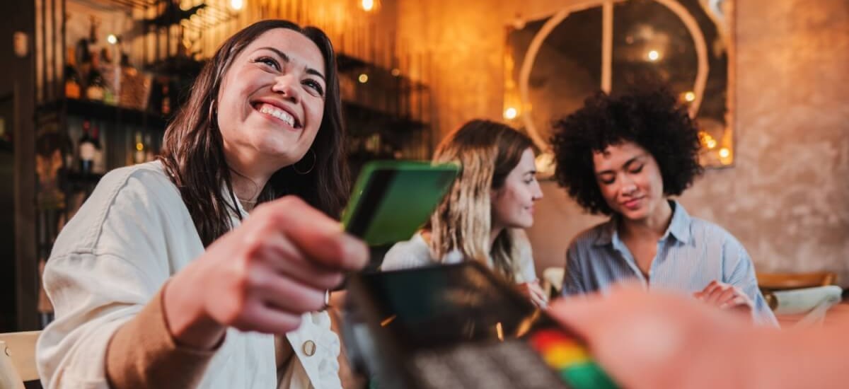 woman paying with Wise card