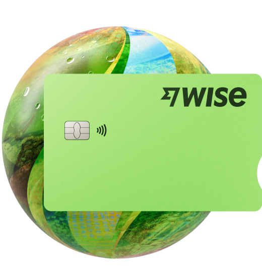 An international travel money card in front of a green globe