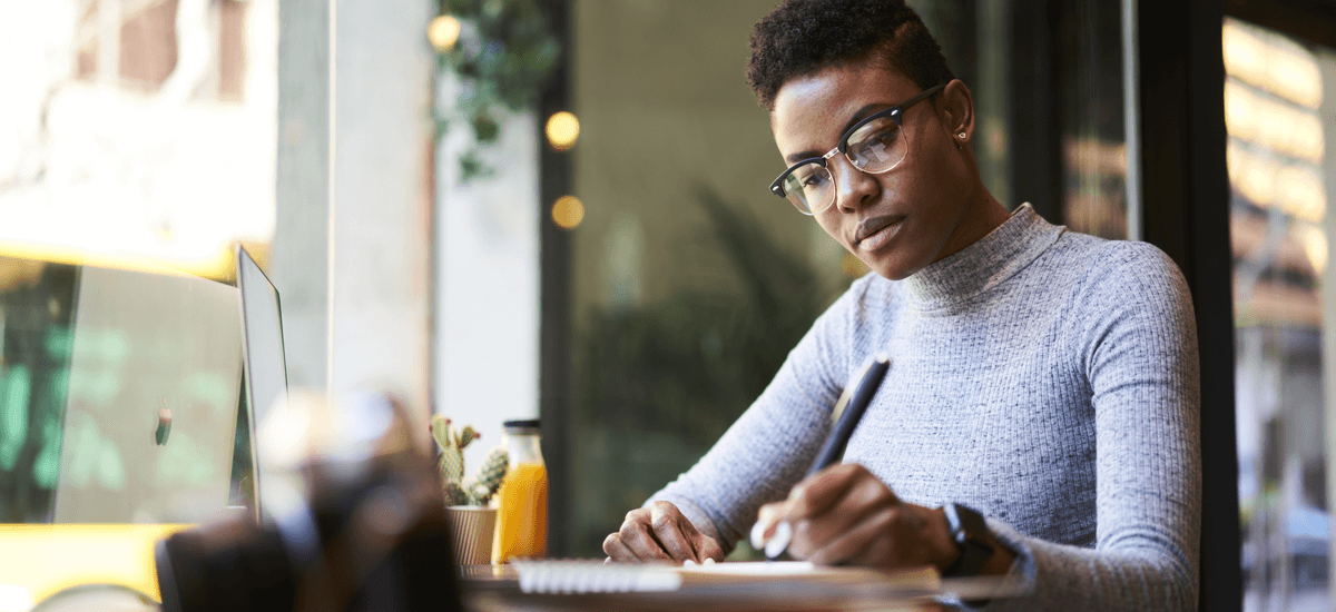 woman-writing-in-notepad
