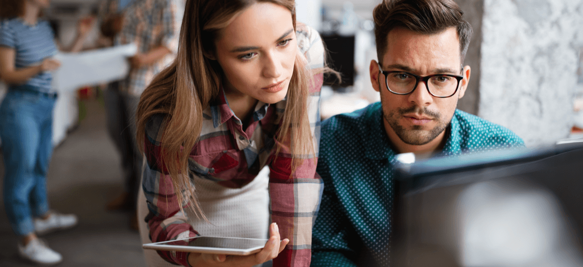 woman-and-man-looking-at-computer