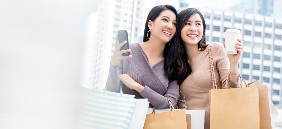 Two women holding shopping bags