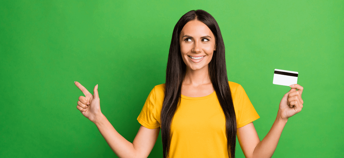happy-brunette-woman-holding-bank-card