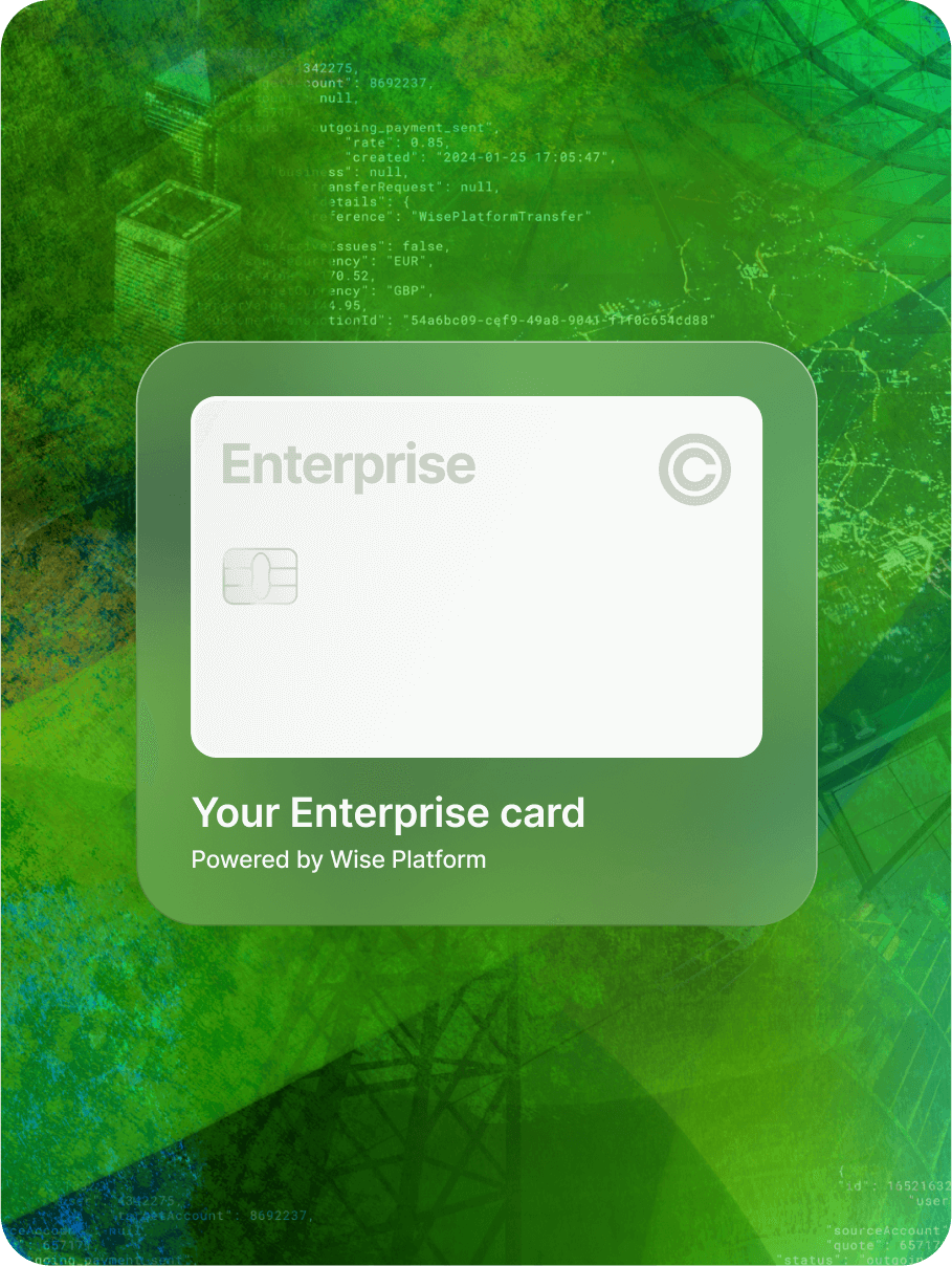 A white generic debit card overlayed on a green tapestry background.